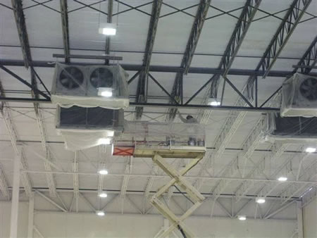 Crew painting beams in a gainesville ga warehouse